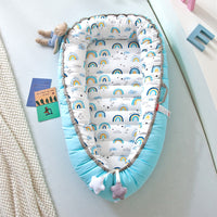 Portable baby crib bed in nursery setting