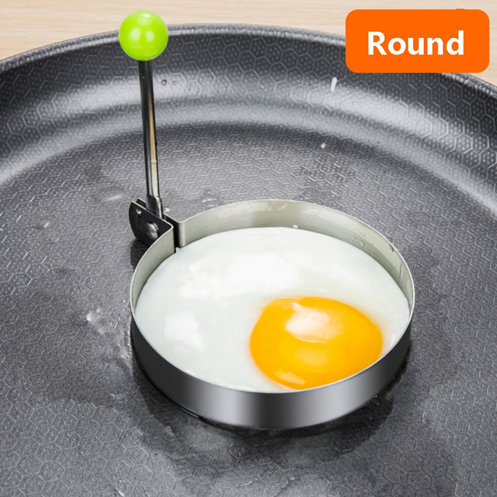 Stainless steel egg and pancake shaper with handle.