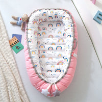 Portable baby crib bed in nursery setting