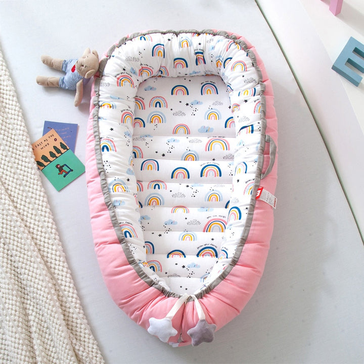 Portable baby crib bed in nursery setting
