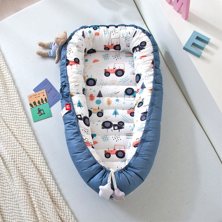 Portable baby crib bed in nursery setting