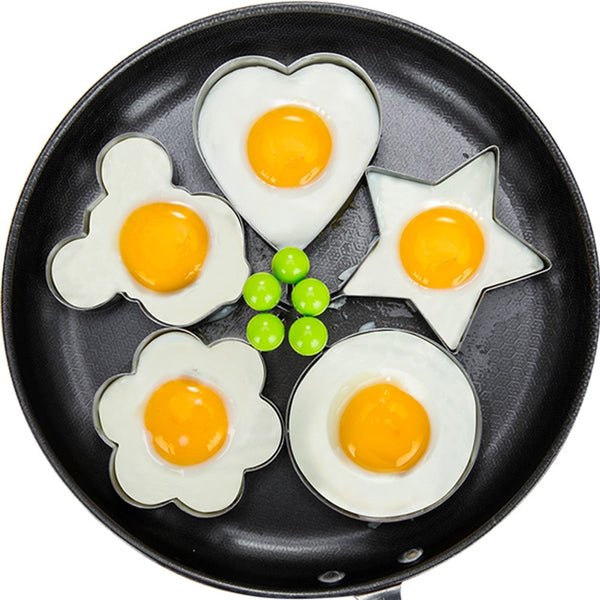 Stainless steel egg and pancake shaper with handle.