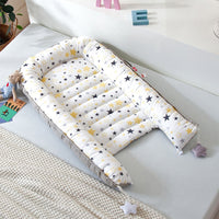 Portable baby crib bed in nursery setting