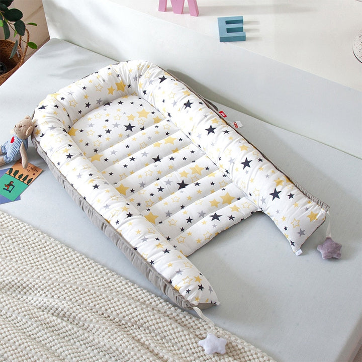 Portable baby crib bed in nursery setting