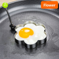 Stainless steel egg and pancake shaper with handle.