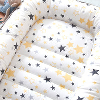 Portable baby crib bed in nursery setting