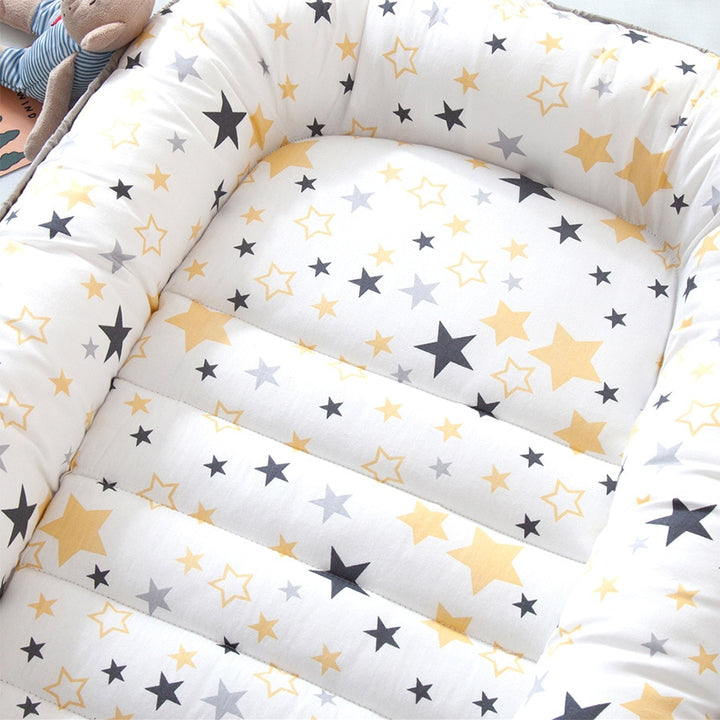 Portable baby crib bed in nursery setting