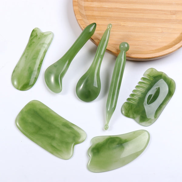 Mushroom jade stone facial roller in use