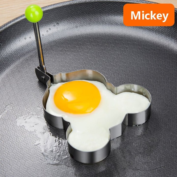 Stainless steel egg and pancake shaper with handle.