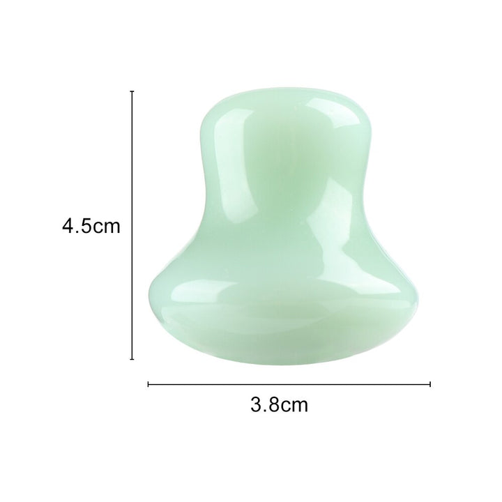 Mushroom jade stone facial roller in use