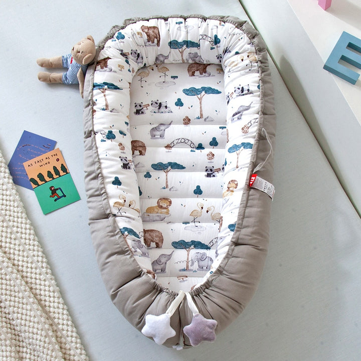 Portable baby crib bed in nursery setting