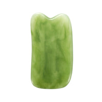 Mushroom jade stone facial roller in use