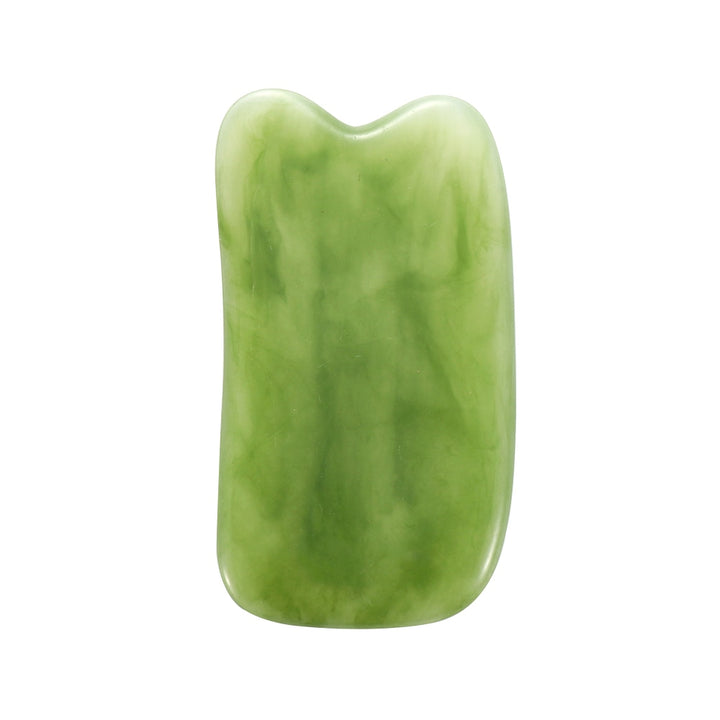 Mushroom jade stone facial roller in use