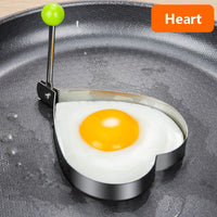 Stainless steel egg and pancake shaper with handle.