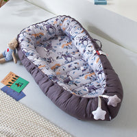 Portable baby crib bed in nursery setting