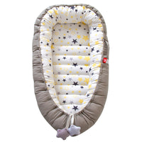 Portable baby crib bed in nursery setting