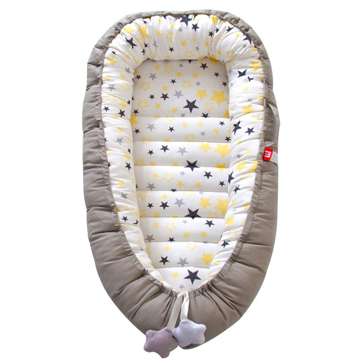 Portable baby crib bed in nursery setting