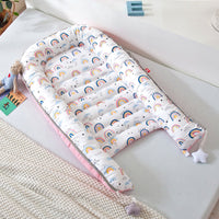 Portable baby crib bed in nursery setting