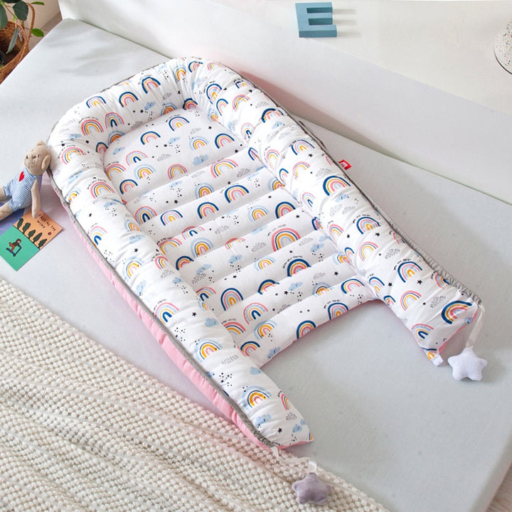 Portable baby crib bed in nursery setting