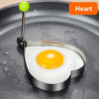 Stainless steel egg and pancake shaper with handle.