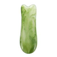 Mushroom jade stone facial roller in use