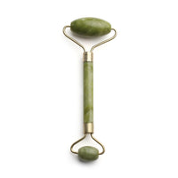 Mushroom jade stone facial roller in use
