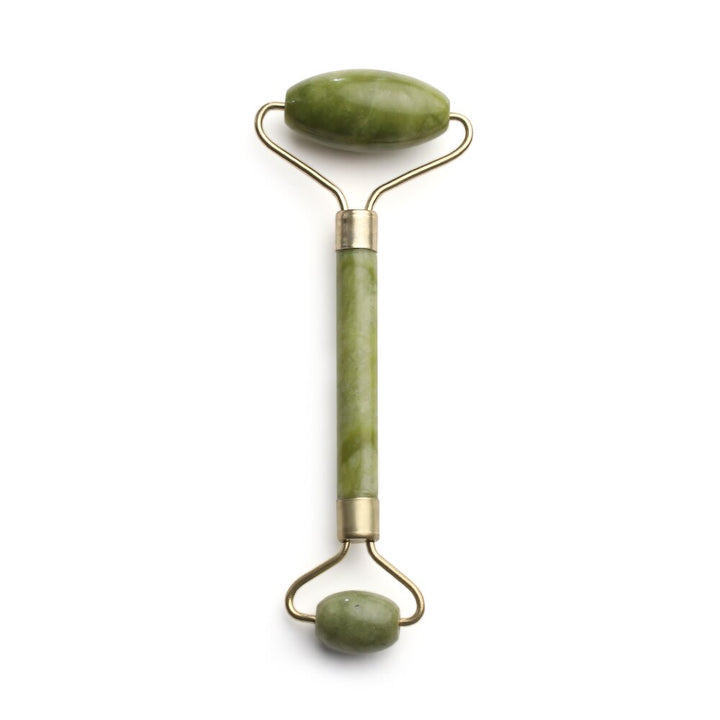 Mushroom jade stone facial roller in use