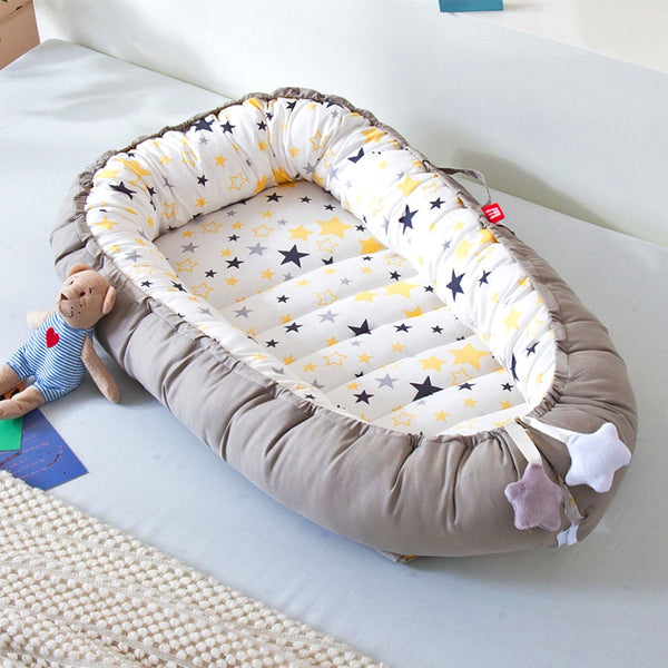 Portable baby crib bed in nursery setting