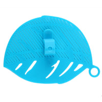 Durable leaf shape rice wash sieve in white color with handle.