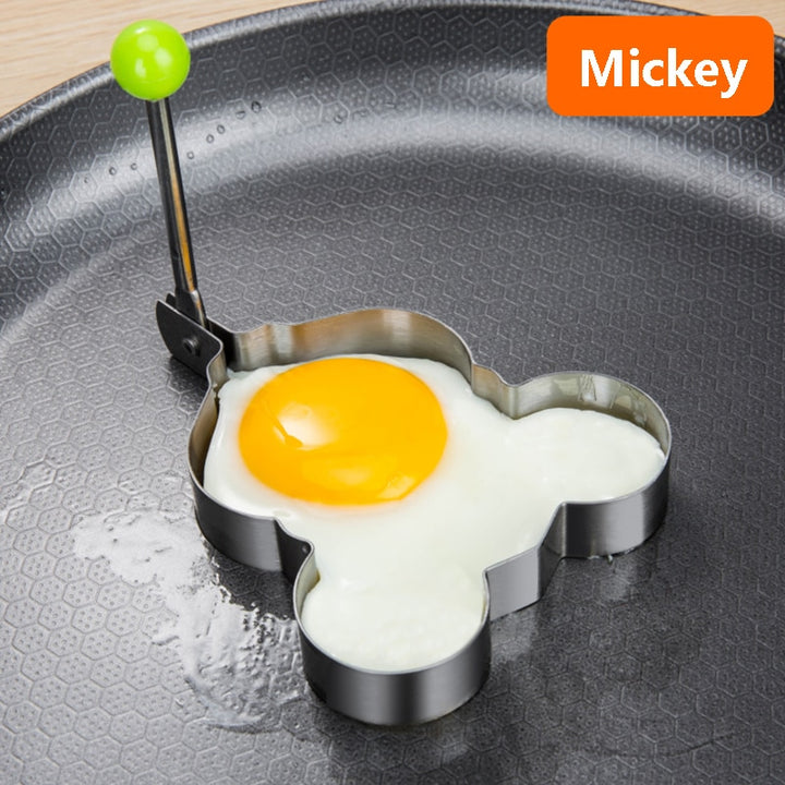 Stainless steel egg and pancake shaper with handle.