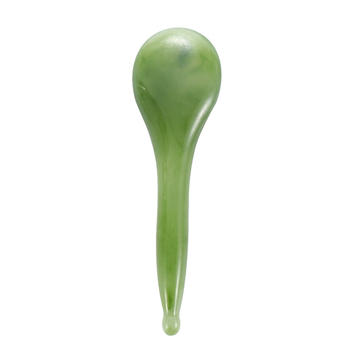 Mushroom jade stone facial roller in use