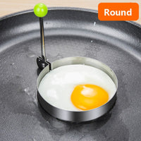 Stainless steel egg and pancake shaper with handle.