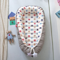 Portable baby crib bed in nursery setting