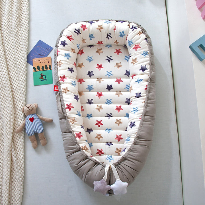 Portable baby crib bed in nursery setting