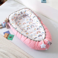 Portable baby crib bed in nursery setting