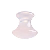Mushroom jade stone facial roller in use