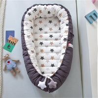 Portable baby crib bed in nursery setting