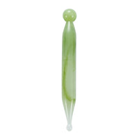 Mushroom jade stone facial roller in use