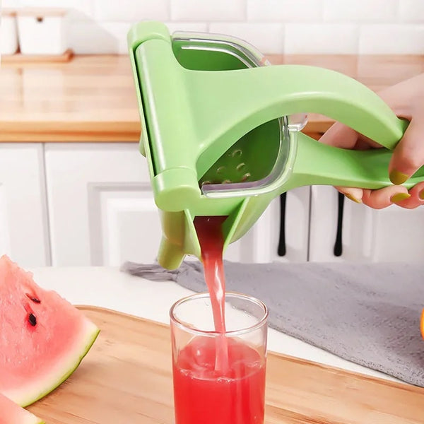 Manual lemon juicer in green
