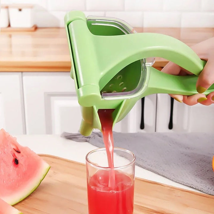Manual lemon juicer in green