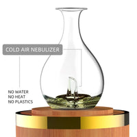 Aromatherapy diffuser with wooden base and glass design
