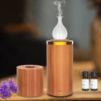 Aromatherapy diffuser with wooden base and glass design
