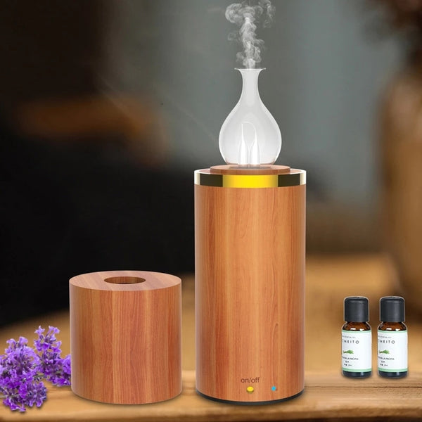 Aromatherapy diffuser with wooden base and glass design