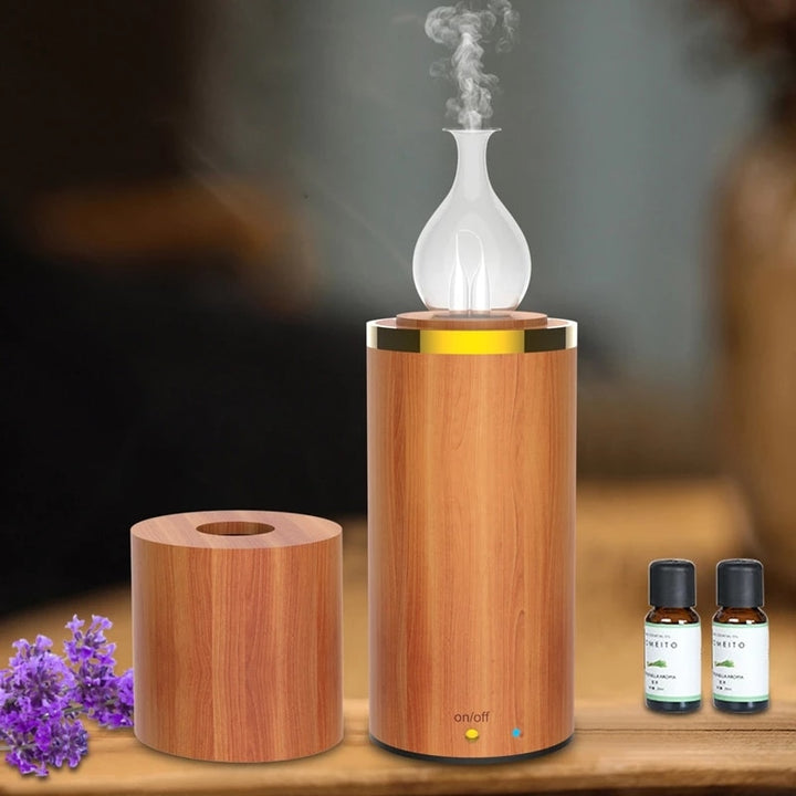 Aromatherapy diffuser with wooden base and glass design