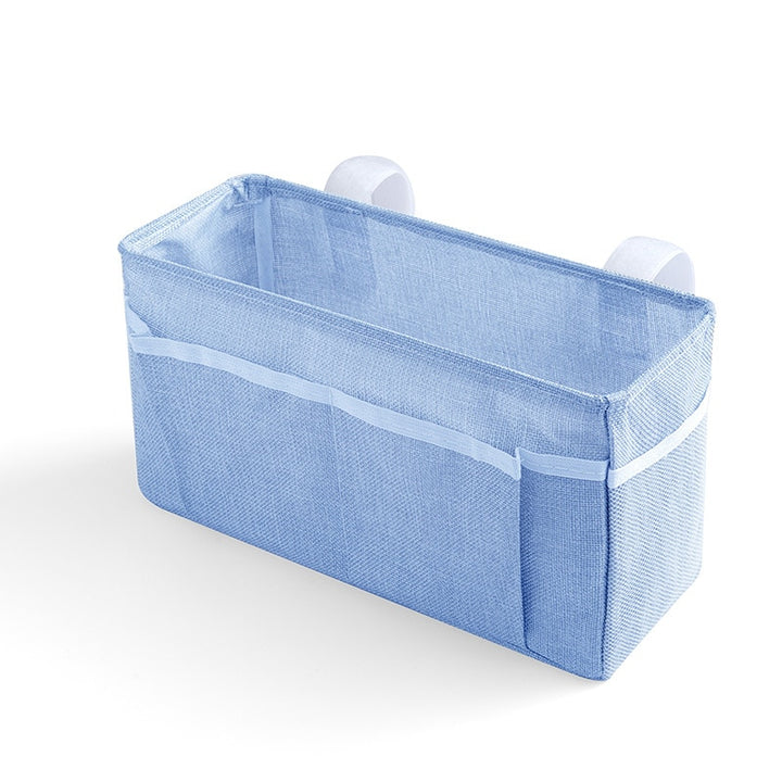 Baby bed organizer with diaper and toy storage capabilities
