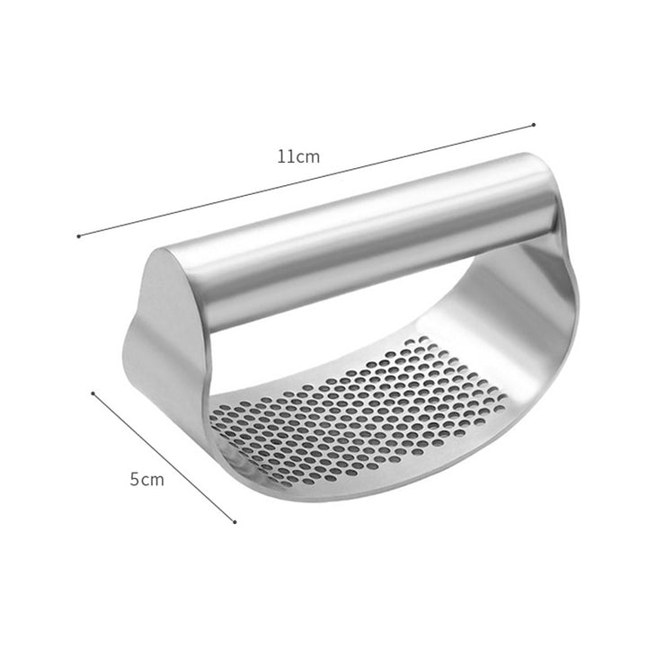Stainless steel garlic press with black plastic handles.