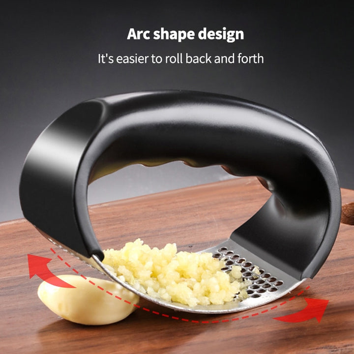 Stainless steel garlic press with black plastic handles.