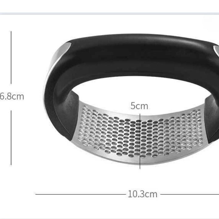 Stainless steel garlic press with rubber handles.