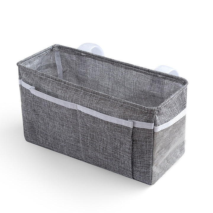 Baby bed organizer with diaper and toy storage capabilities