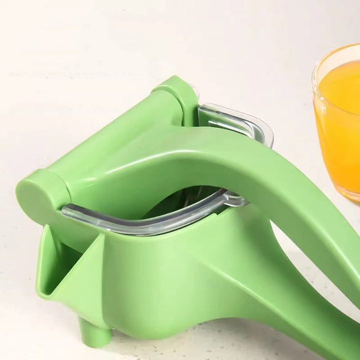 Manual lemon juicer in green